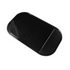 StickyPad anti-slip mat – top view showing a rectangular black mat with a perforated surface.