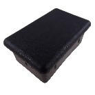 Plastic plugs for aluminium dropside locks – top view showing smooth black rectangular cap with two mounting holes.