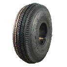 Sivusta näkyvä KINGS TIRE V-6603 -rengas 4.10/3.50-4 – musta kuvio ja venttiili sisärenkaalla.