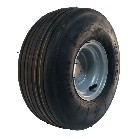 Sidevisning af Kompletthjul 15x6.00-6 KINGS TIRE V-3503 – grå stålfælg med sort dæk og 6PR konstruktion.