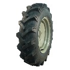 Tractor tire – angled view showcasing deep tread pattern and black color with KINGS TIRE V-8509 branding.