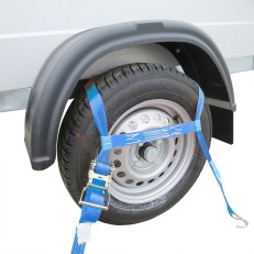 Tensioning strap – side view showing blue securing strap and metal ratchet buckle for vehicle transport.