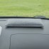 Deumidificatore riutilizzabile – design compatto in grigio e nero – vista dall'alto su un campo verde.