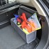Borsa per il bagagliaio dell'auto – vista laterale – grigia con dettagli arancioni e scomparti multipli.