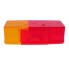 Toppvy av Reservglas SAW / HELLA 7098 – röd och orange, rektangulär form med linsmönster.
